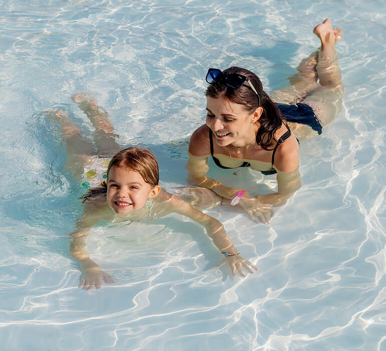 mom and daughter in pool