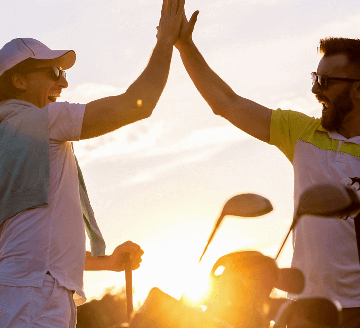 golfers high fiving